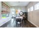 Charming dining area with a modern chandelier, fun window treatments, and unique decor at 6817 Ebb Tide Ave, Apollo Beach, FL 33572