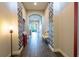 Elegant foyer featuring wood flooring, decorative walls, and a view into the living area at 6817 Ebb Tide Ave, Apollo Beach, FL 33572