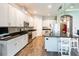 Spacious kitchen featuring white cabinets, stainless steel appliances, and a large center island at 6817 Ebb Tide Ave, Apollo Beach, FL 33572