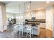 Modern kitchen with a large island, pendant lighting, and stainless steel appliances at 6817 Ebb Tide Ave, Apollo Beach, FL 33572