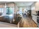 Modern kitchen with a large island, granite countertops, stainless steel appliances, and pendant lighting at 6817 Ebb Tide Ave, Apollo Beach, FL 33572
