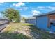 The backyard features a spacious lawn and partial fencing at 6834 Mesa Verde St, Port Richey, FL 34668