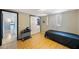 Cozy bedroom with minimalist decor, featuring a storage door and standard windows at 6834 Mesa Verde St, Port Richey, FL 34668