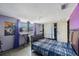 Bedroom featuring a bed, a keyboard, a closet, and a poster on the wall at 6834 Mesa Verde St, Port Richey, FL 34668