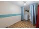 Laundry room features standard appliances, an overhead light and linoleum flooring at 6834 Mesa Verde St, Port Richey, FL 34668