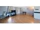 Inviting living room featuring laminate wood flooring and ample natural light at 6834 Mesa Verde St, Port Richey, FL 34668