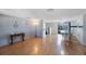 Large living room with open floor plan, featuring a dining area and access to the yard at 6834 Mesa Verde St, Port Richey, FL 34668