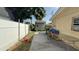 Features a backyard with a shed and a grill, enclosed by a white fence at 7206 Reindeer Rd, Tampa, FL 33619