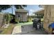 Features a backyard with a shed and a grill at 7206 Reindeer Rd, Tampa, FL 33619
