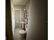 View of a bathroom with a pedestal sink, toilet, shower with a curtain, and tiled floor at 7206 Reindeer Rd, Tampa, FL 33619