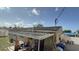 Shows the exterior of the home with a brown roof and an overhang area at 7206 Reindeer Rd, Tampa, FL 33619