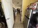 View from kitchen showcasing stainless steel appliances and tile flooring at 7206 Reindeer Rd, Tampa, FL 33619