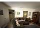 Inviting living room featuring neutral walls, comfortable seating, and decorative wall art at 7206 Reindeer Rd, Tampa, FL 33619