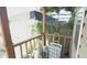 View of the porch with brown railings, a basket, and a mannequin at 7206 Reindeer Rd, Tampa, FL 33619
