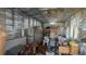 Unfinished room with exposed metal framing, ceiling fan, and various stored items at 7206 Reindeer Rd, Tampa, FL 33619