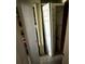 Messy storage room featuring stacked doors, tiled floor, and household items at 7206 Reindeer Rd, Tampa, FL 33619