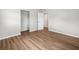 Clean, bright bedroom with wood-look flooring and closet at 7571 Ridge Rd, Seminole, FL 33772