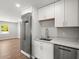 Modern kitchen features stainless steel refrigerator and marble countertops at 7571 Ridge Rd, Seminole, FL 33772