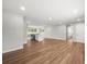Open concept living area features hardwood floors, neutral paint, and an eat-in kitchen with stainless steel appliances at 7571 Ridge Rd, Seminole, FL 33772