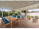 Covered patio offers ample seating with a dining and lounge area perfect for entertaining at 7571 Ridge Rd, Seminole, FL 33772