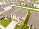 Aerial view of home with well-manicured lawn and landscaping in a community with white fence at 81 Rain Lily Ave, Spring Hill, FL 34609