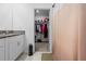 Bathroom featuring a sink, shower with curtain, and walk-in closet at 81 Rain Lily Ave, Spring Hill, FL 34609