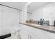 Modern bathroom with granite countertop vanity, white cabinets, subway tile and shower/tub combo at 81 Rain Lily Ave, Spring Hill, FL 34609