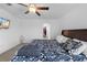 Comfortable bedroom featuring a ceiling fan and a walk-in closet at 81 Rain Lily Ave, Spring Hill, FL 34609