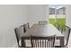 Bright dining area with natural light and view of the backyard through sliding glass door at 81 Rain Lily Ave, Spring Hill, FL 34609