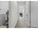 Hallway with doorways leading to various rooms within the home at 81 Rain Lily Ave, Spring Hill, FL 34609