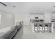 View of the open-concept living area showcasing kitchen island with seating at 81 Rain Lily Ave, Spring Hill, FL 34609