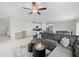 Spacious living area with modern decor and connecting kitchen and dining spaces at 81 Rain Lily Ave, Spring Hill, FL 34609