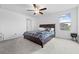 Well-lit bedroom with a large window and a comfortable queen-sized bed at 81 Rain Lily Ave, Spring Hill, FL 34609