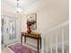 Bright foyer featuring decorative tile flooring, staircase, and beautiful glass-paneled front door at 829 Date Palm Ln, St Petersburg, FL 33707