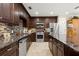Stylish kitchen featuring stainless steel appliances, granite countertops, and tile backsplash at 829 Date Palm Ln, St Petersburg, FL 33707