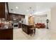 Well-equipped kitchen with stainless steel appliances, granite countertops, and a cozy breakfast nook at 829 Date Palm Ln, St Petersburg, FL 33707
