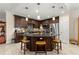 Modern kitchen with a center island, stainless steel appliances, and dark wood cabinetry at 829 Date Palm Ln, St Petersburg, FL 33707
