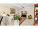 Cozy living room with plush seating, stylish decor, and elegant tile flooring at 829 Date Palm Ln, St Petersburg, FL 33707