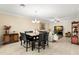 Open concept living space features a dining area adjacent to the living room, perfect for entertaining at 829 Date Palm Ln, St Petersburg, FL 33707