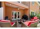 Inviting outdoor patio with comfortable seating, grill, and access to the interior through French doors at 829 Date Palm Ln, St Petersburg, FL 33707