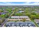 A high angle aerial view of townhouse apartments with lush green spaces and tree coverage around the complex at 8714 Palm Ranches Pl, Tampa, FL 33614