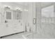 This modern bathroom features a glass shower, a toilet, and a white vanity with chrome fixtures at 8714 Palm Ranches Pl, Tampa, FL 33614