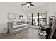 An additional bedroom features a daybed with a trundle, a large window, a desk, and hardwood floors at 8714 Palm Ranches Pl, Tampa, FL 33614