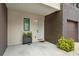 Inviting entryway with a modern planter, small window, and a clean, bright aesthetic leading into the home at 8714 Palm Ranches Pl, Tampa, FL 33614