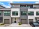 Contemporary townhome featuring neutral color palette, private balconies, and attached garages for convenient parking at 8714 Palm Ranches Pl, Tampa, FL 33614