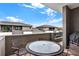 This patio has a table, chairs, and a grill with views of other properties at 8714 Palm Ranches Pl, Tampa, FL 33614