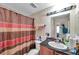 Bathroom featuring a vanity, toilet, and shower with a patterned curtain at 9481 Highland Oak Dr # 806, Tampa, FL 33647