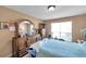 Bedroom featuring a window and furniture, with beige walls and light beige carpeting at 9481 Highland Oak Dr # 806, Tampa, FL 33647