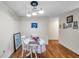Dining area boasting wooden floors, table setting, and tastefully decorated walls at 9481 Highland Oak Dr # 806, Tampa, FL 33647