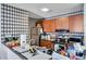 Well-lit kitchen features modern appliances, dark wood cabinets, and decorative black-and-white backsplash at 9481 Highland Oak Dr # 806, Tampa, FL 33647